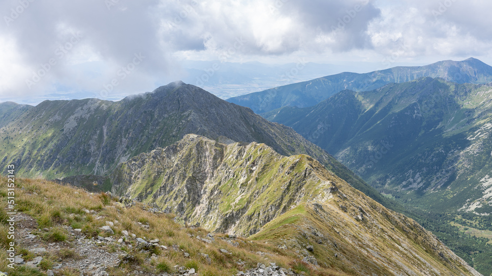 Obraz premium Grassy mountain ranges shrouded in low clouds, Slovakia, Europe
