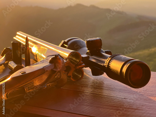 Close up of rifle  for  hunting. View from the window on sunrise.