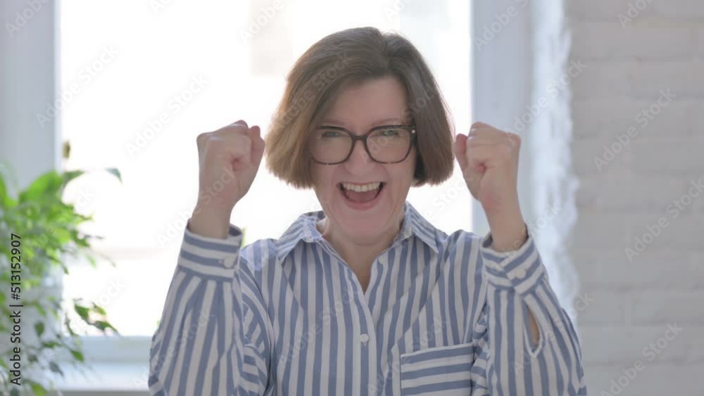 Excited Senior Woman Celebrating Success Excited Senior Woman Celebrating Success