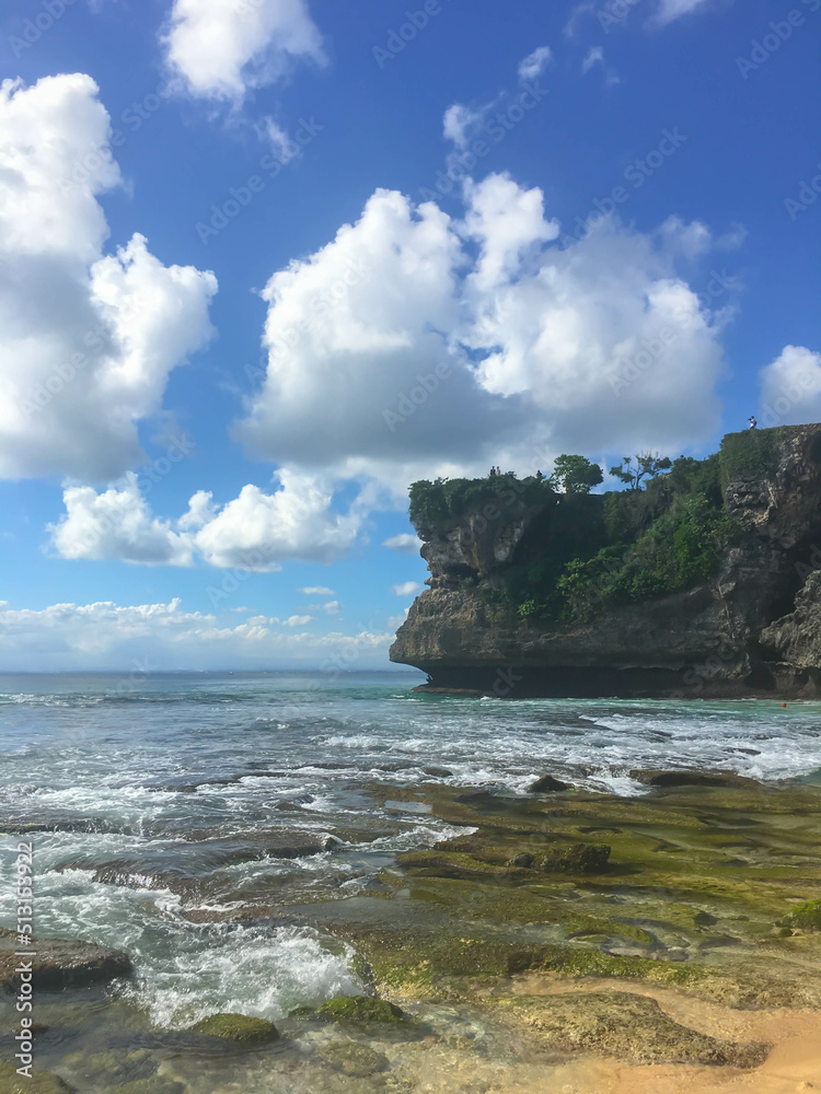 Sand beach in Bali with tropical sea and blue sky