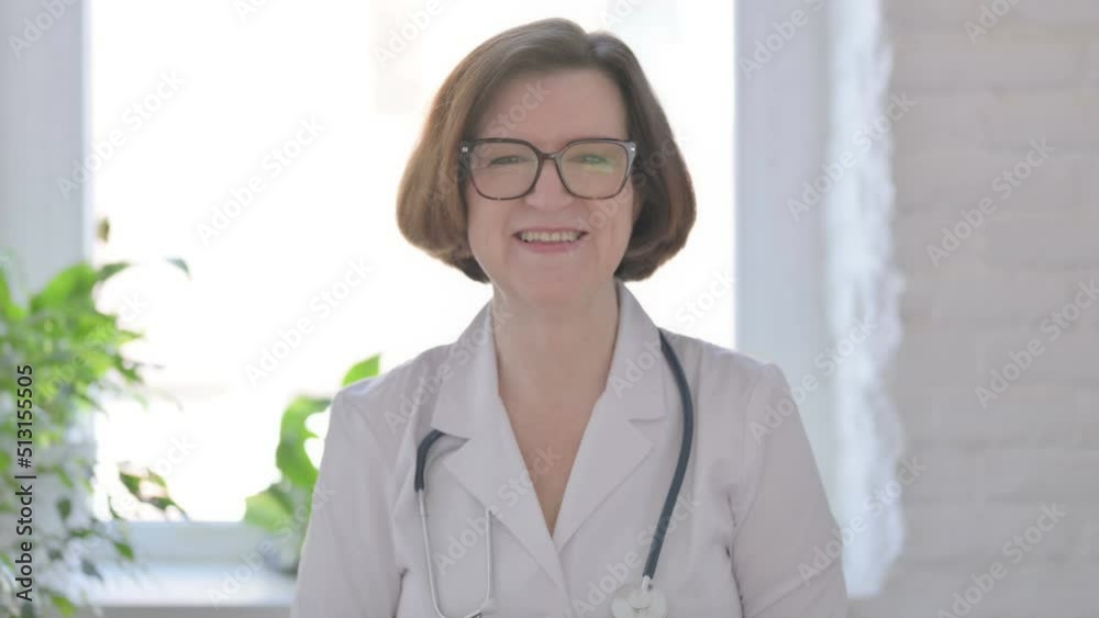 Senior Female Doctor Talking on Online Video Call Senior Female Doctor Talking on Online Video Call