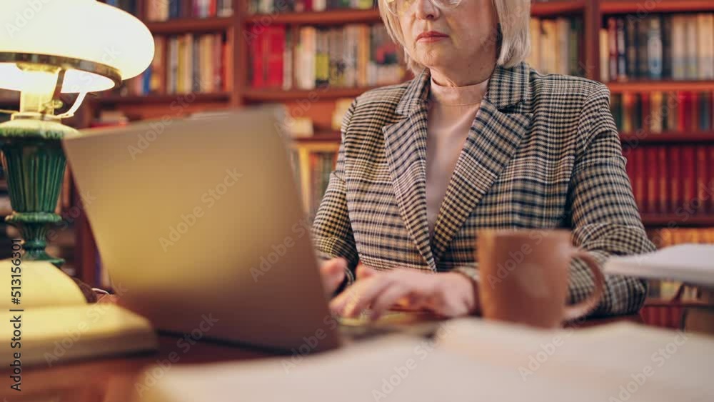 Overworked journalist writing new article on laptop, working late, remote job