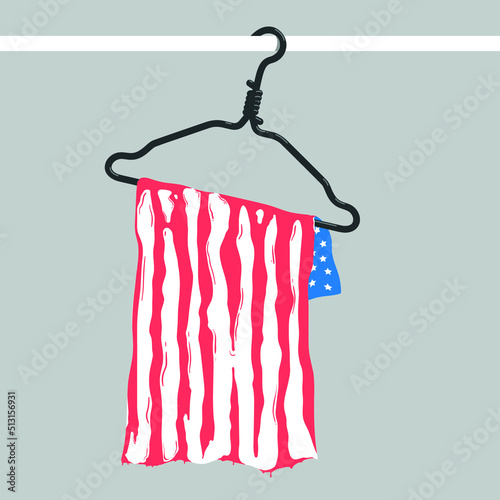 The US flag hangs on a metal hanger. The hanger is a symbol of non-medical abortion. Red streaks of blood are dripping from the towel. Ban abortion in the USA. Law violates women's rights