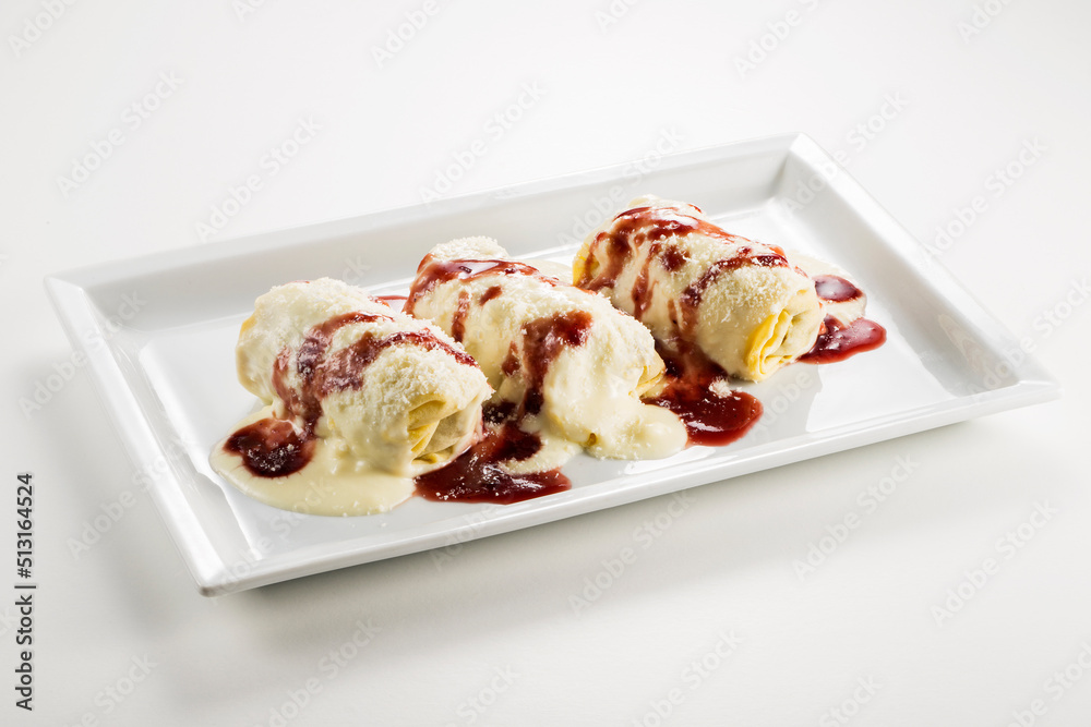 Rectangular plate with Pasta roll with meat sauce and wine sauce Rectangular plate with Pasta roll with meat sauce and wine sauce