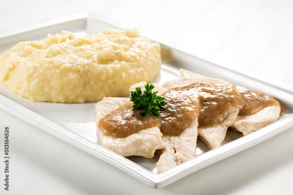 Rectangular plate with slices of white meat and mashed potatoes Rectangular plate with slices of white meat and mashed potatoes