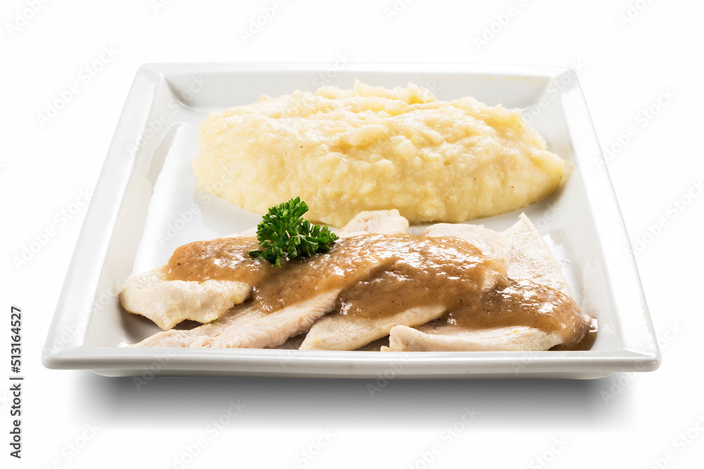 Rectangular plate with slices of white meat and mashed potatoes