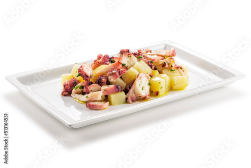 Rectangular plate with steamed octopus and potatoes