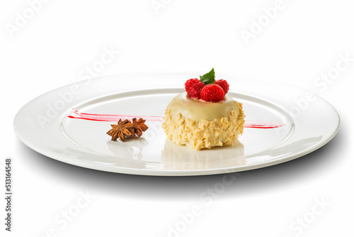 White round plate with small white Sacher with raspberries
