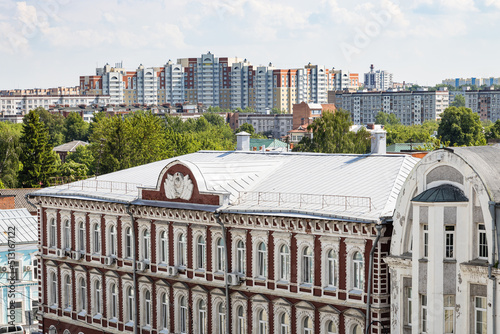 above view of new high-rise apatment buildings in Old Kolomna city on summer day from bell tower Church of St John the Evangelist photo