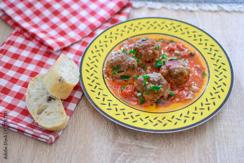 Round meatballs from Romanian traditional cuisine with bolognese sauce photo