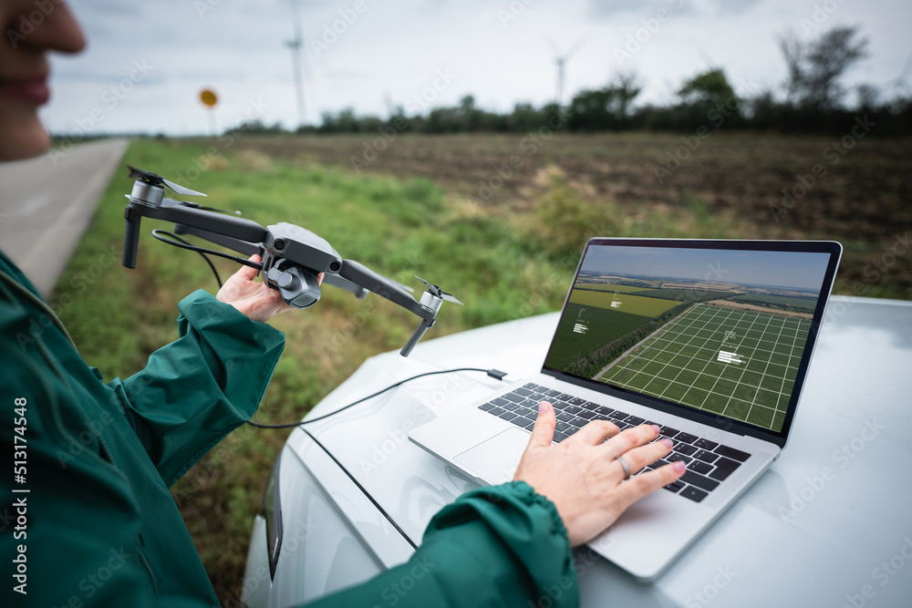 Farmer with laptop and drone on the field. Smart farming and agriculture digitalization	 - obrazy, fototapety, plakaty 
