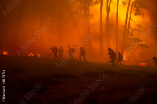 Firefighters suppressing wildfire photo