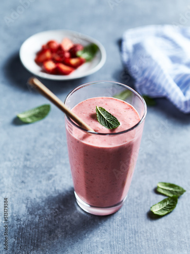 Glass of strawberry-banana smoothie made with yoghurt 