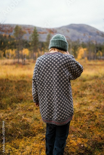 Lonely person standing alone in the nature photo