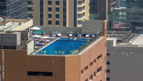 Photography Rooftop swimming pool viewed from above timelapse, Aerial top view at financial district
