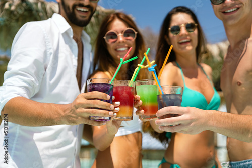 Group of friends together enjoying party, cocktails on summer vacation. People travel fun concept.