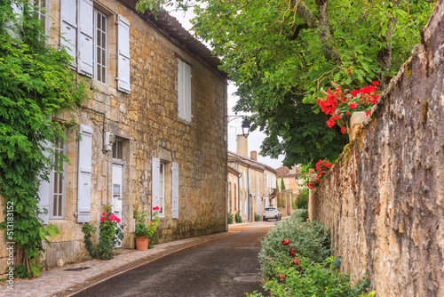 Summer city landscape - view of a medieval street in a provincial French town  in the historical province Gascony  the region of Occitanie of southwestern France
