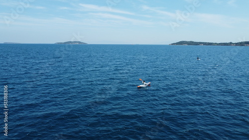 sea view and people doing padel board. drone shooting