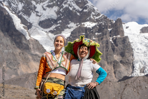 turista mujer conversando con una señora de los andes del Ausangate en Cusco Perú. photo