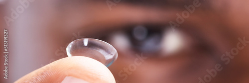 Принти на полотні Man Holding Contact Lens In His Finger