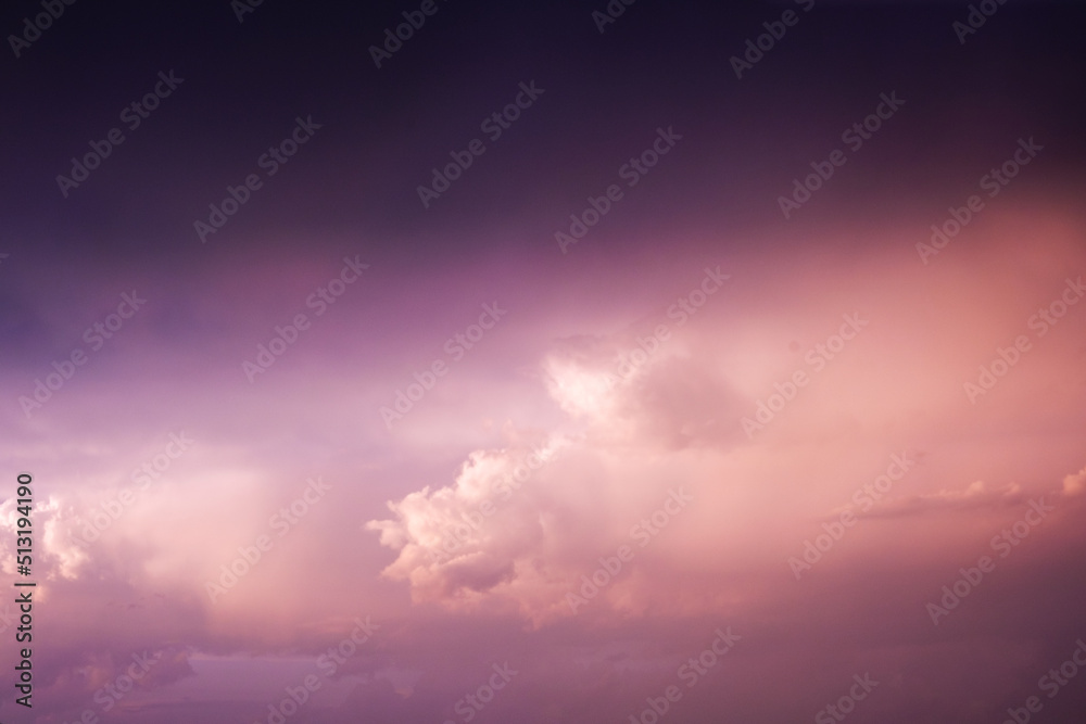 Obraz premium Colored sky, clouds and rooftop view. There are many fluffy clouds in the sky
