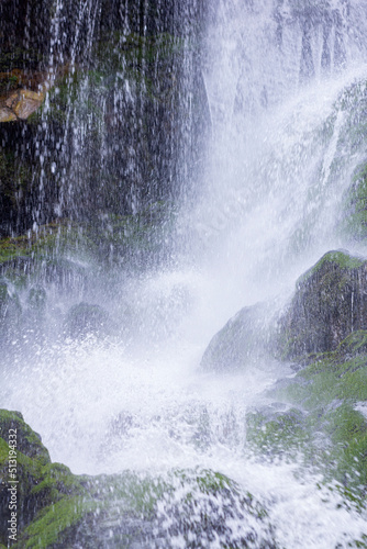 Mountain waterfall. Travel concept with family and friends.