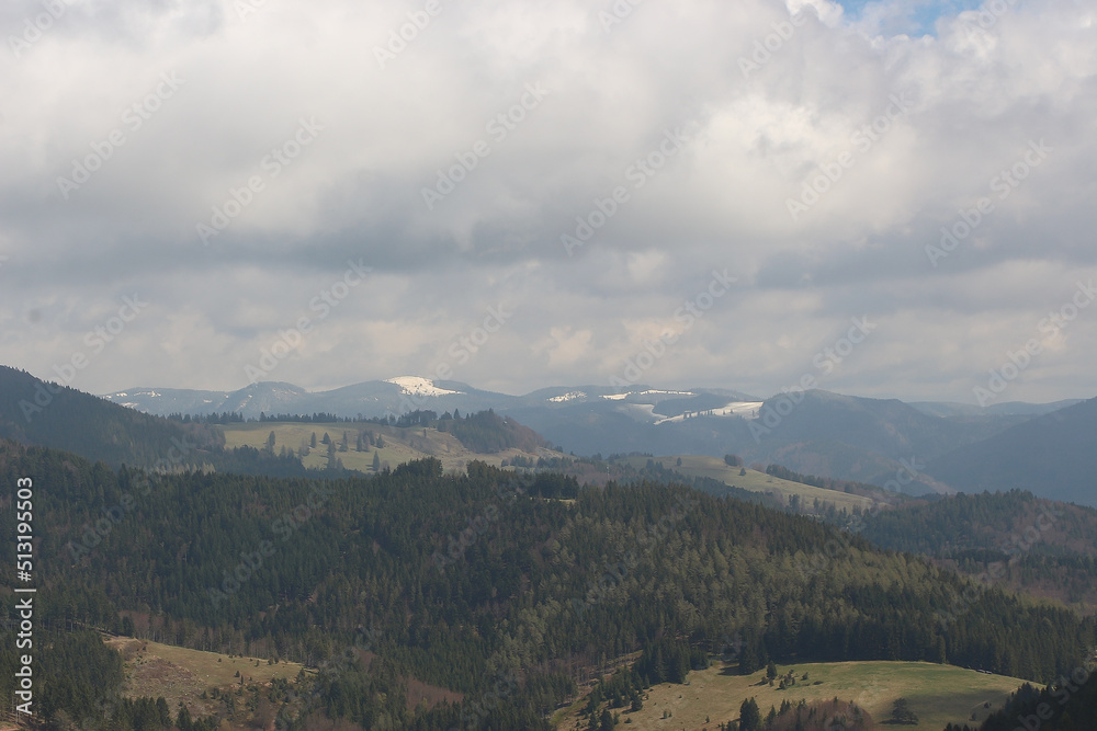 Sweeping views over the tree lined and occasionally snowy valleys and hills of the Black forest around Badenweiler in southern Germany near the border with Switzerland at the heart of Europe