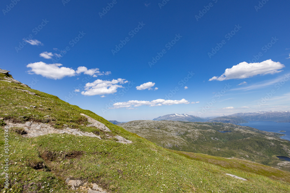 Hiking to the mountains Seterfjellet a warm and beautiful summer day , Northern Norway- Europe	