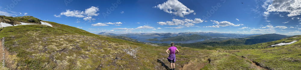 Hiking to the mountains Seterfjellet a warm and beautiful summer day , Northern Norway- Europe	