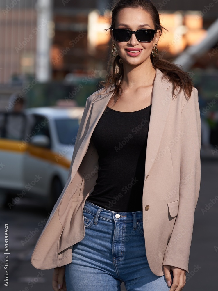 stylish fashionable girl in sunglasses in the metropolis