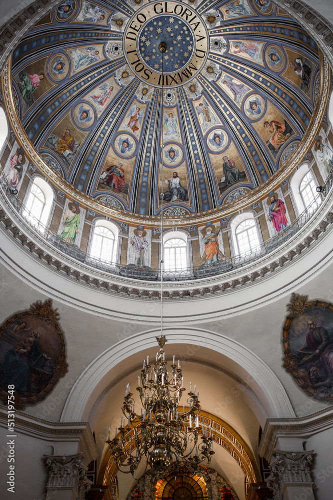 round dome in a catholic church with painted interior