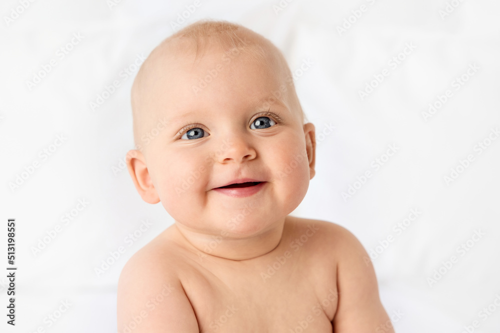 Portrait of smiling chubby baby girl with blue eyes Portrait of smiling chubby baby girl with blue eyes
