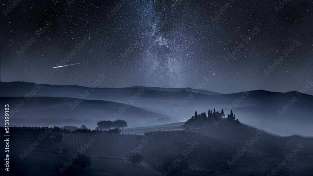 Milky way over valley in Tuscany at night, Italy, timelapse