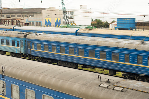 Blue carriages of a passenger train at the Mariupol railway station.