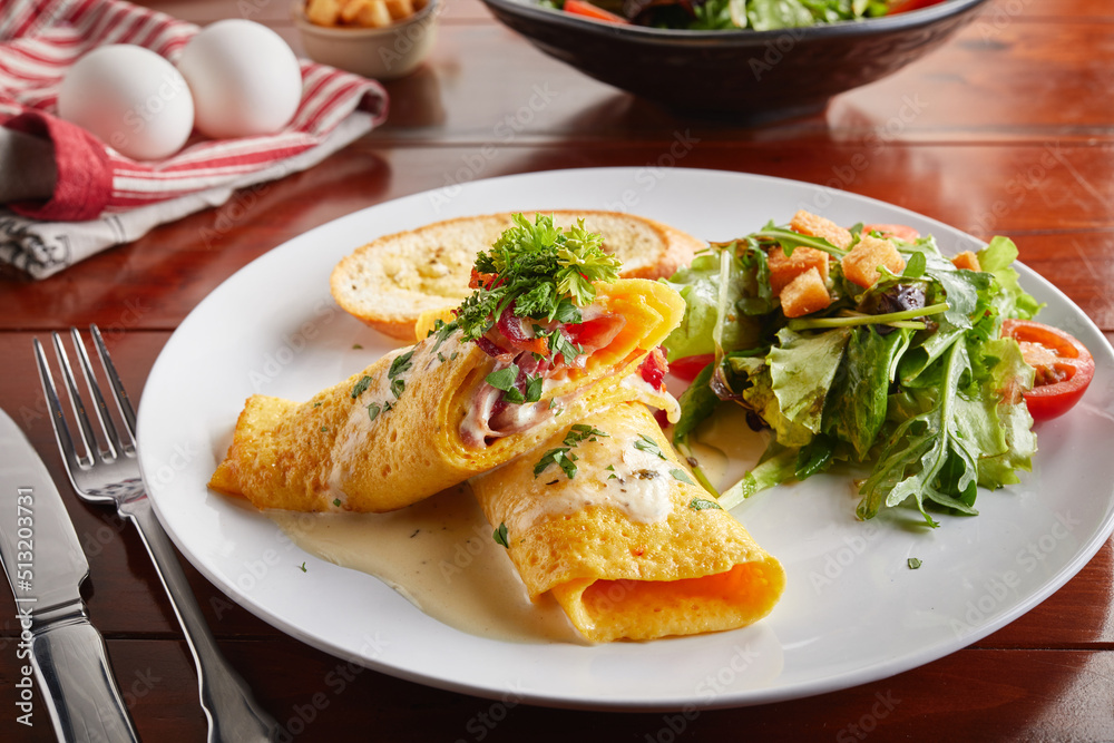 Egg Rolled with salad served in a dish isolated on wooden background side view