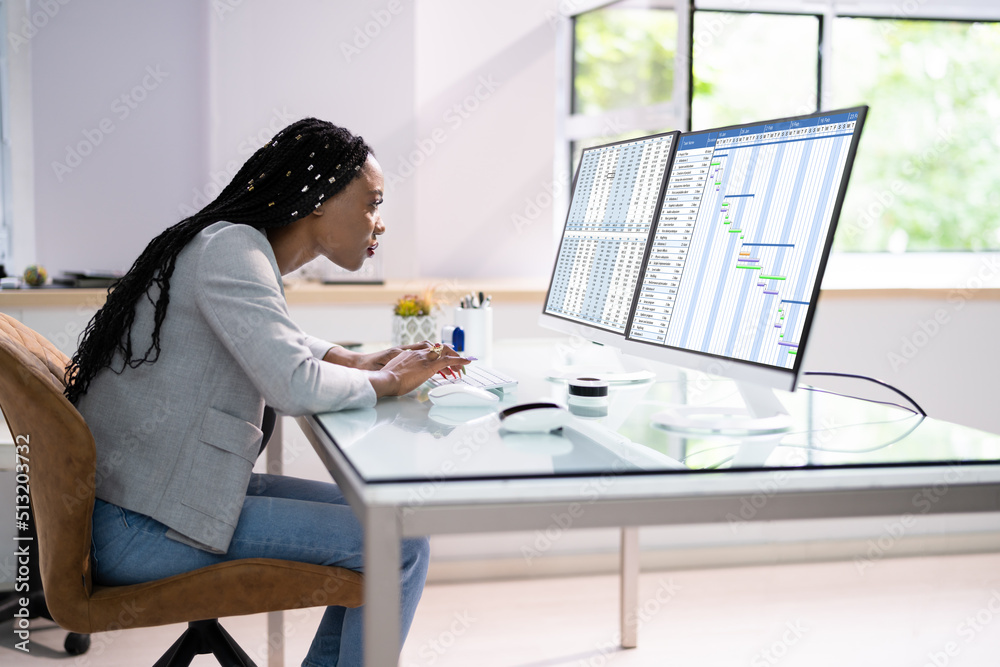 Businesswoman Sitting In Wrong Posture Working On Computer