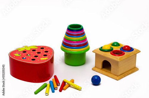 Children's educational safe toys for the youngest made of wood and multicolored plastic.