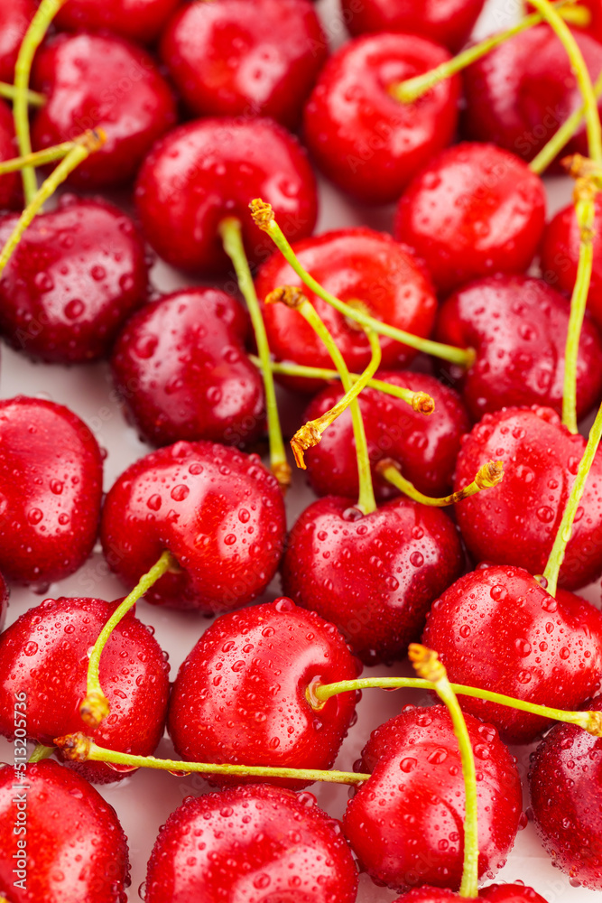 Red cherry close-up. Fresh cherries in water drops. Red berries for diet food Red cherry close-up. Fresh cherries in water drops. Red berries for diet food
