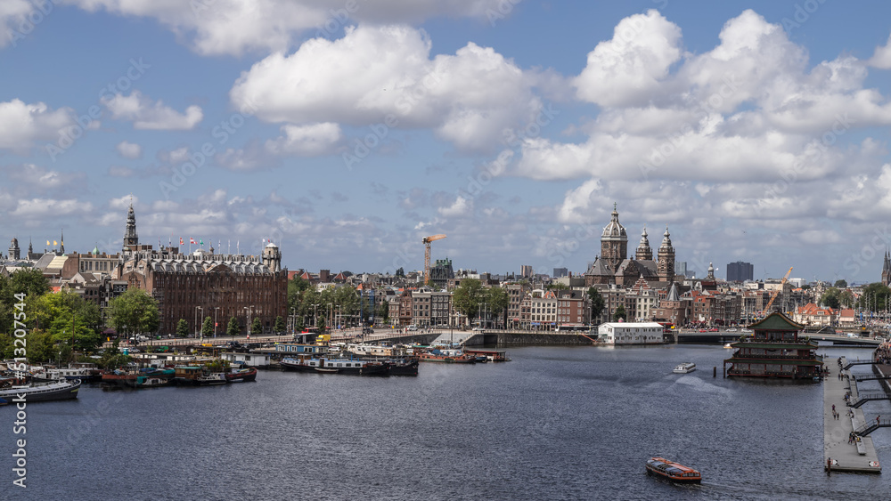 Panoramic view of the city center of Amsterdam including the Basilica of Saint Nicholas.