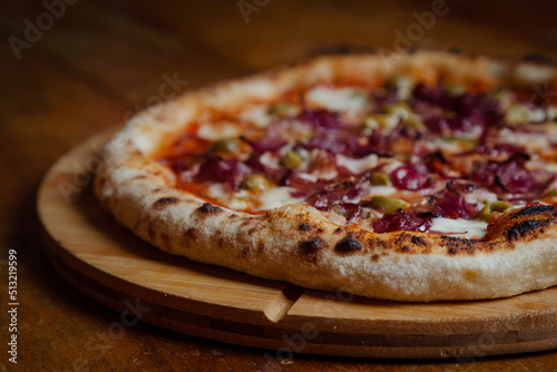 Pizza on wooden table