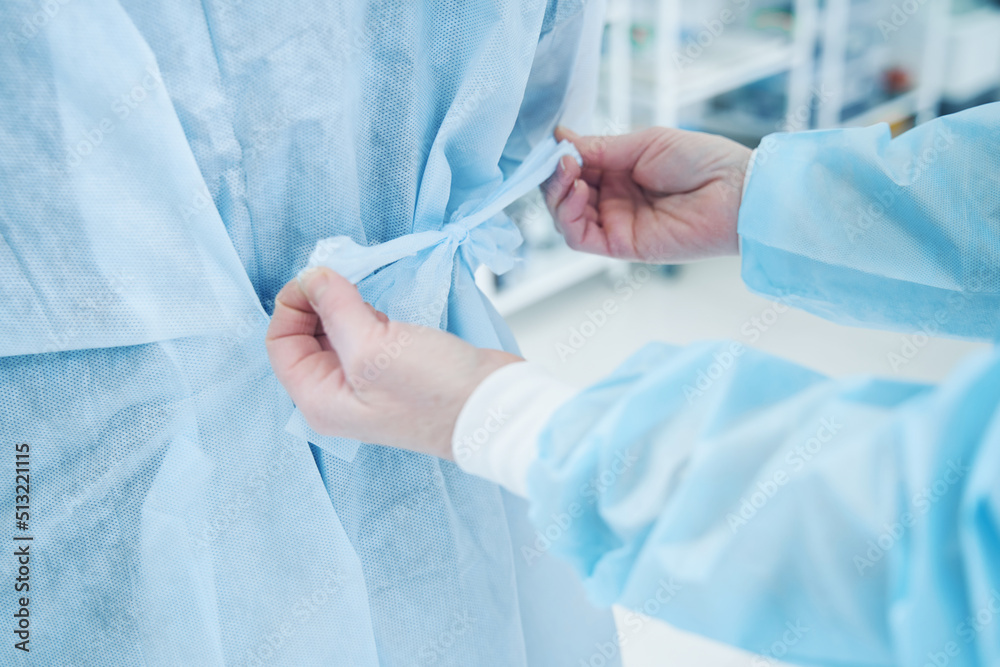Surgeon in the operation room wearing uniform Surgeon in the operation room wearing uniform