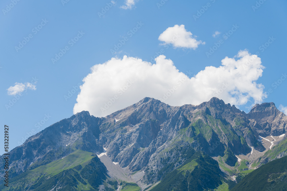 Landscape rocky mountain massif sky white clouds