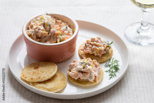 Party canapes, blinis with salmon spread