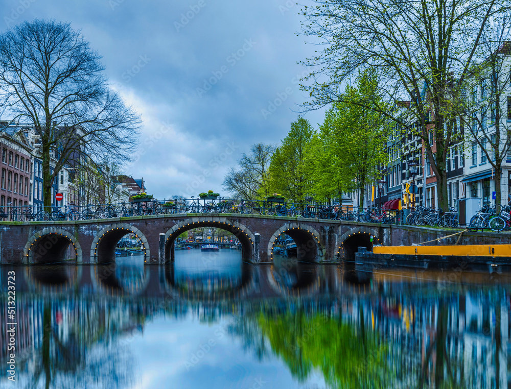 Long exposure shot of canal bridge in Amsterdam, Netherlands