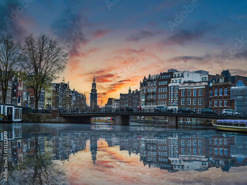 Long exposure shot of canal side Dutch buildings in Amsterdam, Netherlands
