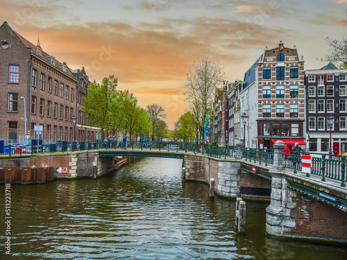 Photography Canal bridge and colourful Dutch buildigs in Amsterdam, Netherlands