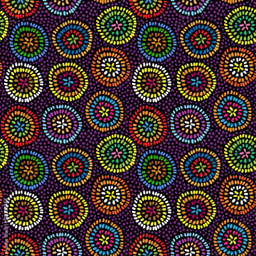 Abstract colorful doodle seamless pattern. Dotted multicolor circles on black background. Textile design
