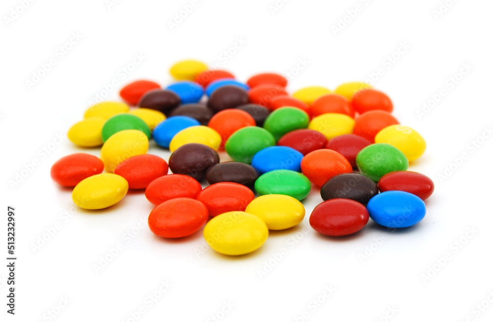 Closeup of colorful chocolate candies on white Closeup of colorful chocolate candies on white