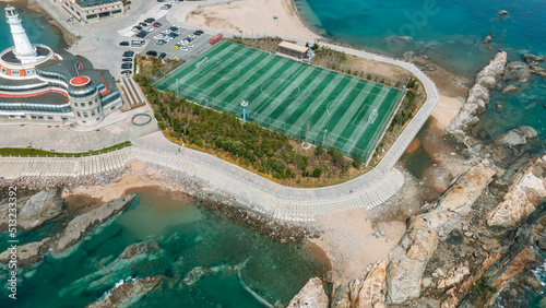 Aerial photography of reef football field along the coast of Qingdao