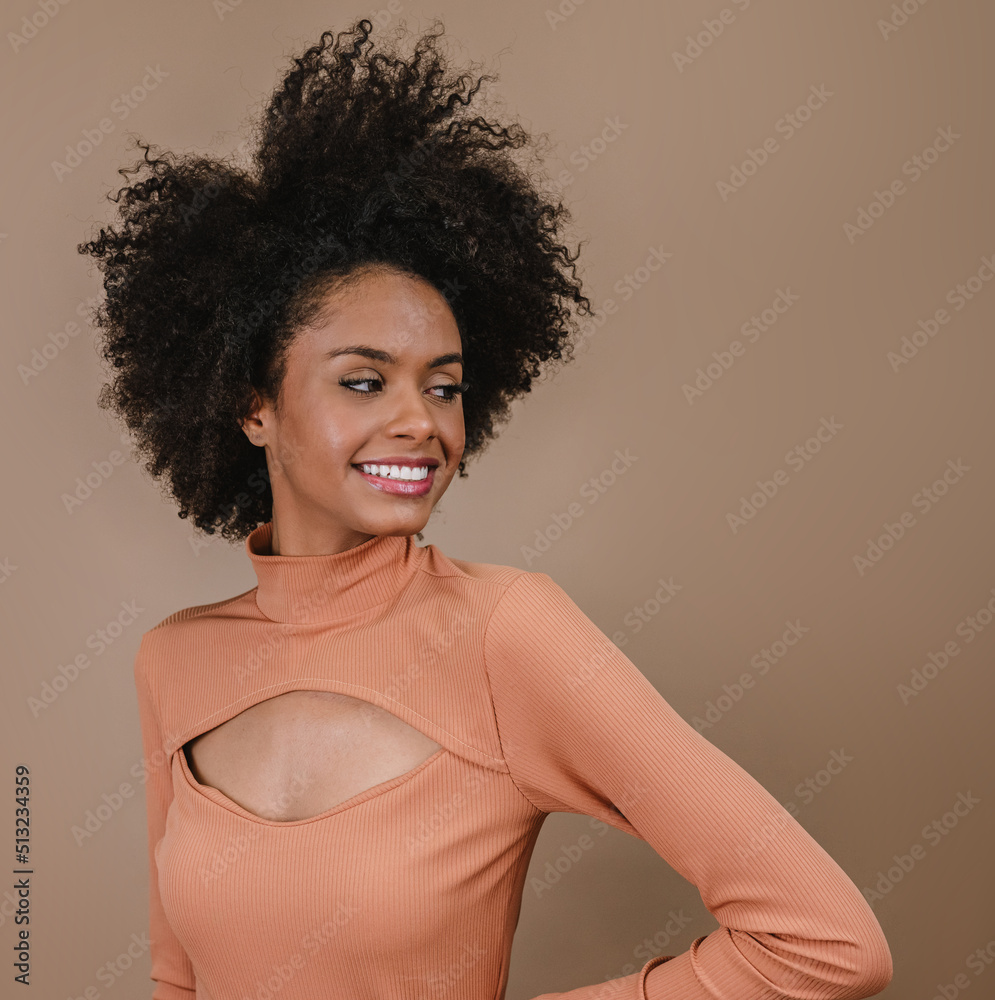 Closeup of a smiling young Latin afro woman. Joy, positive and love. Beautiful african-style hair. Pastel studio background. Closeup of a smiling young Latin afro woman. Joy, positive and love. Beautiful african-style hair. Pastel studio background.